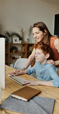 Mother and son on computer